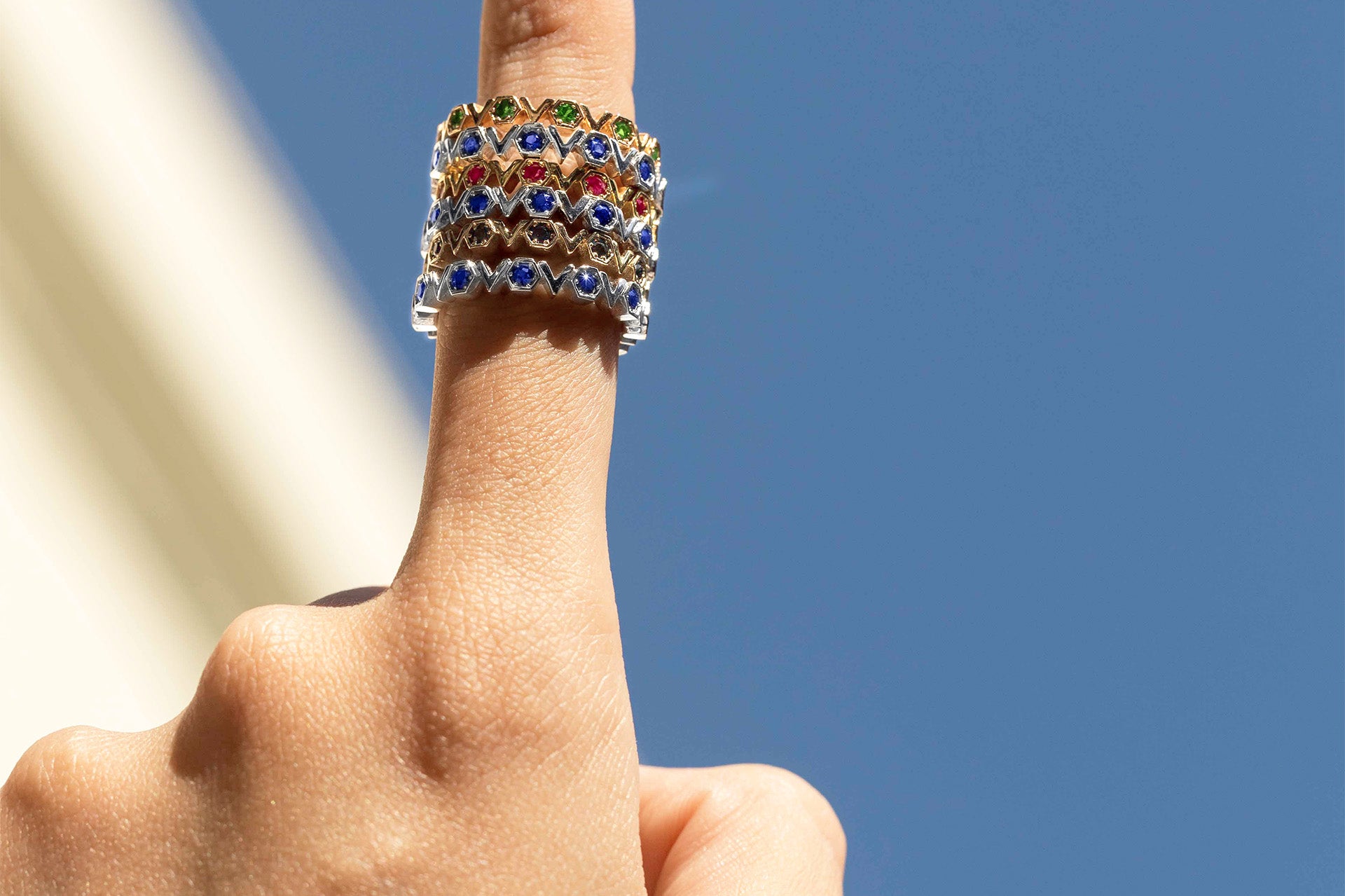 Stack of three White Gold and Blue Sapphire Rings with hexagons and V shapes, Medium - Model shot