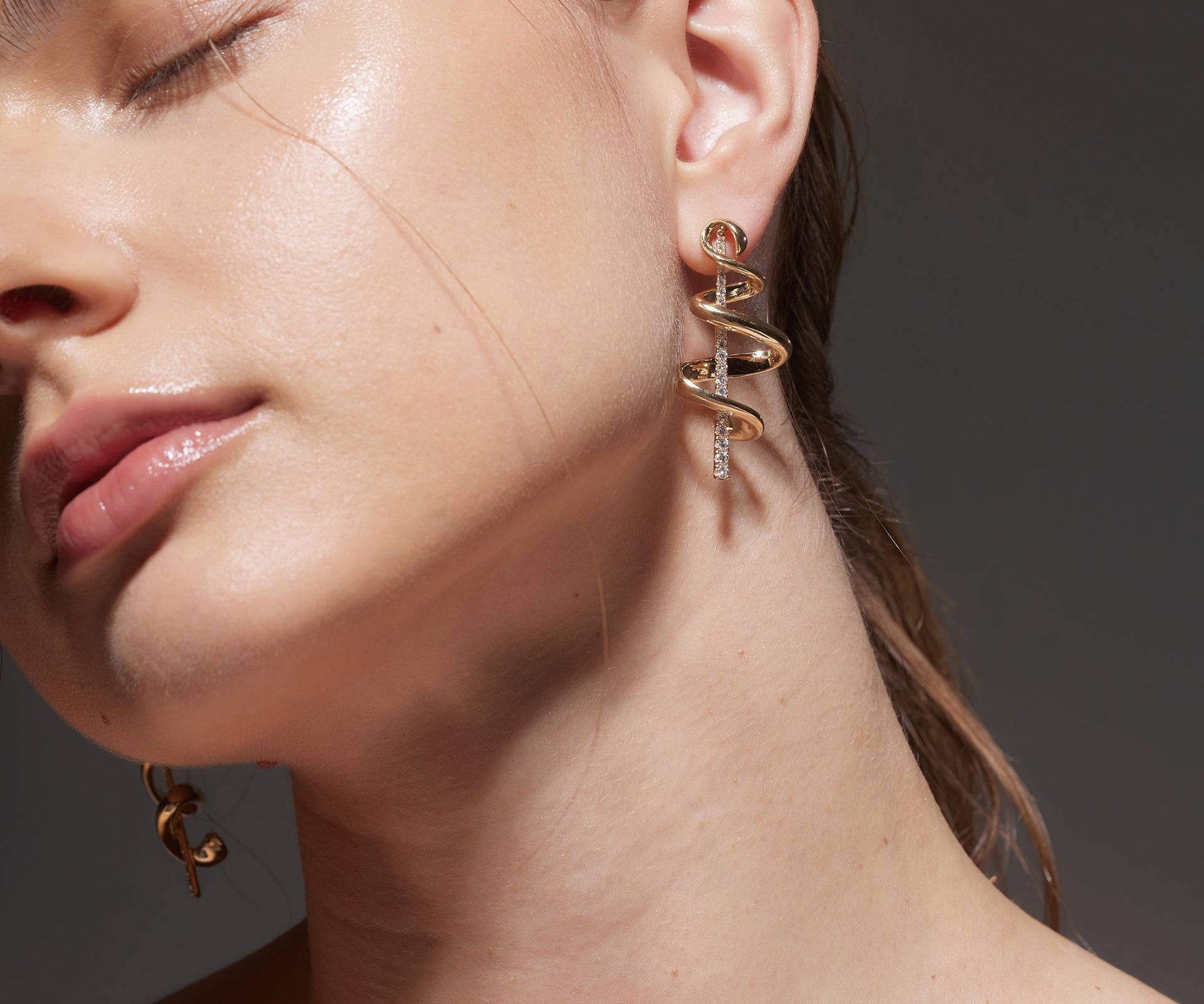 Earrings with Yellow Gold ribbon swirled around rod of Diamonds, Large - Model shot